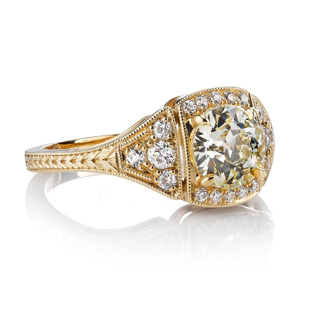 1.17ct QR/VS old European cut diamond set in a handcrafted 18K yellow gold mounting. A classic Art Deco design that features three panels, a low profile, and beautiful hand engraving.