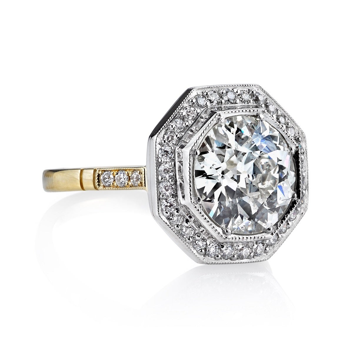 2.47ct H/SI2 EGL certified old European cut diamond set in a handcrafted platinum and 18k yellow gold mounting. An octagonal halo design featuring a low profile, two toned metal and intricate gallery.