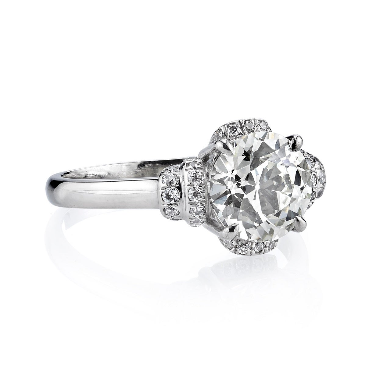 2.00ct L/VS1 EGL certified old European cut diamond set in a handcrafted platinum mounting. An Art Deco inspired design featuring a prong set diamond and diamond ribbon accents.