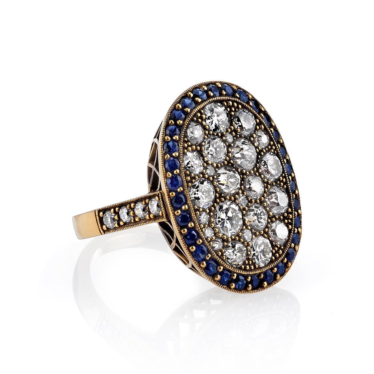 2.66ctw old European, old Mine, Round Brilliant, Single cut and vintage Cushion cut diamonds with 0.85ctw Sapphire surround set in hand crafted 18K oxidized yellow gold mounting. Prices may vary according to total diamond weight. Measurements 22.5mm
