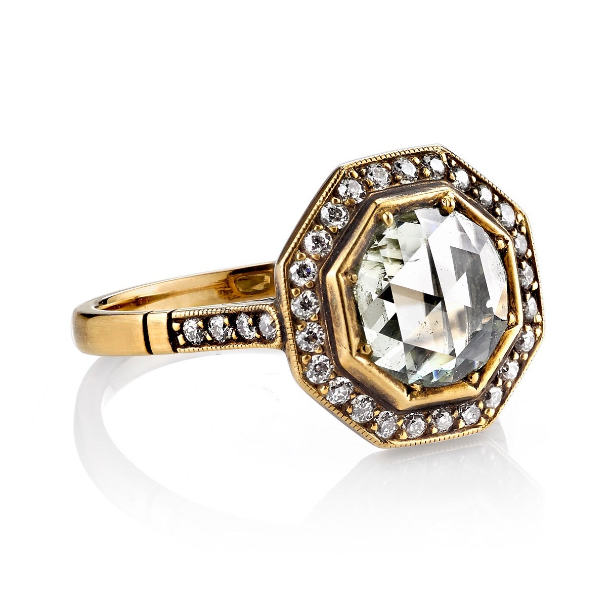 1.15ct Light Yellow. SI2 Rose cut diamond set in a handcrafted 18k oxidized yellow gold mounting. An octagonal halo design featuring a low profile and intricate gallery.
