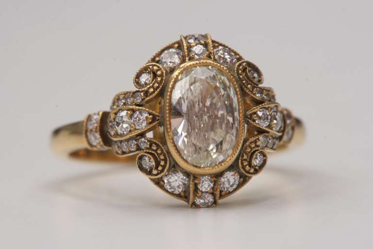 1.00ct K/VS2 Oval diamond set in an oxidized 18k yellow gold hand crafted 
