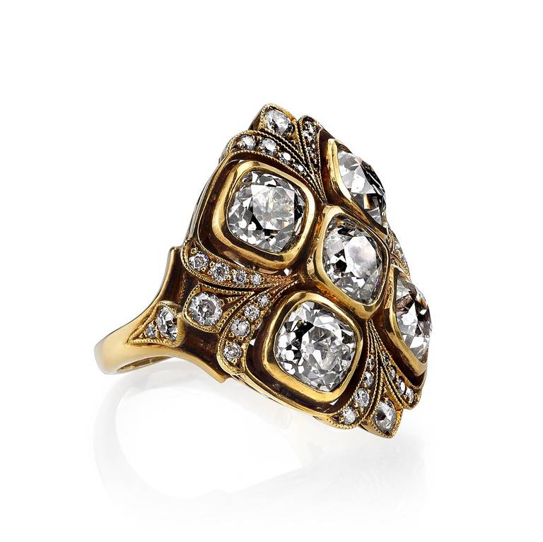 5.18ctw HIJ/VS2-SI1 vintage Cushion cut diamonds set in a hand crafted 18K oxidized yellow gold mounting.