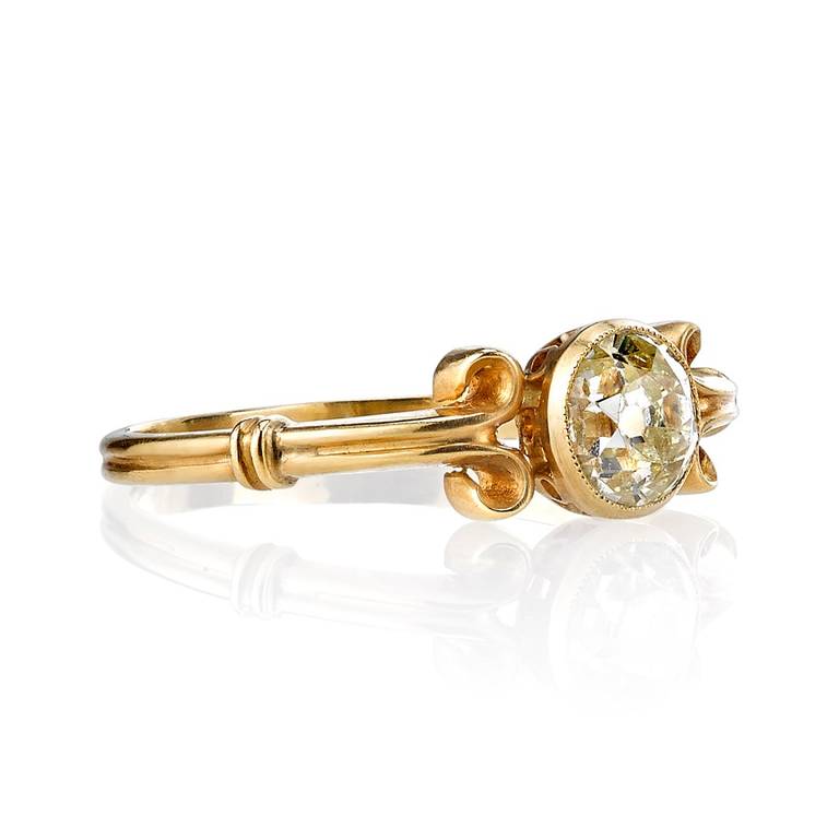0.69ct Fancy Light Yellow/SI2 Cushion cut diamond set in an 18kt yellow gold hand crafted 