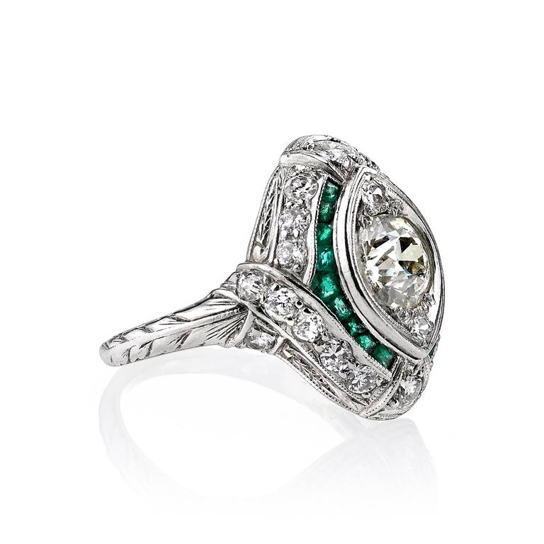 engagement ring with emerald accent