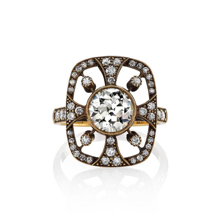 1.14ct Brown/SI2 old European cut diamond set in a handcrafted 18K oxidized yellow gold mounting. A classic Art Nouveau design that features a bezel set diamond and dynamic lines.