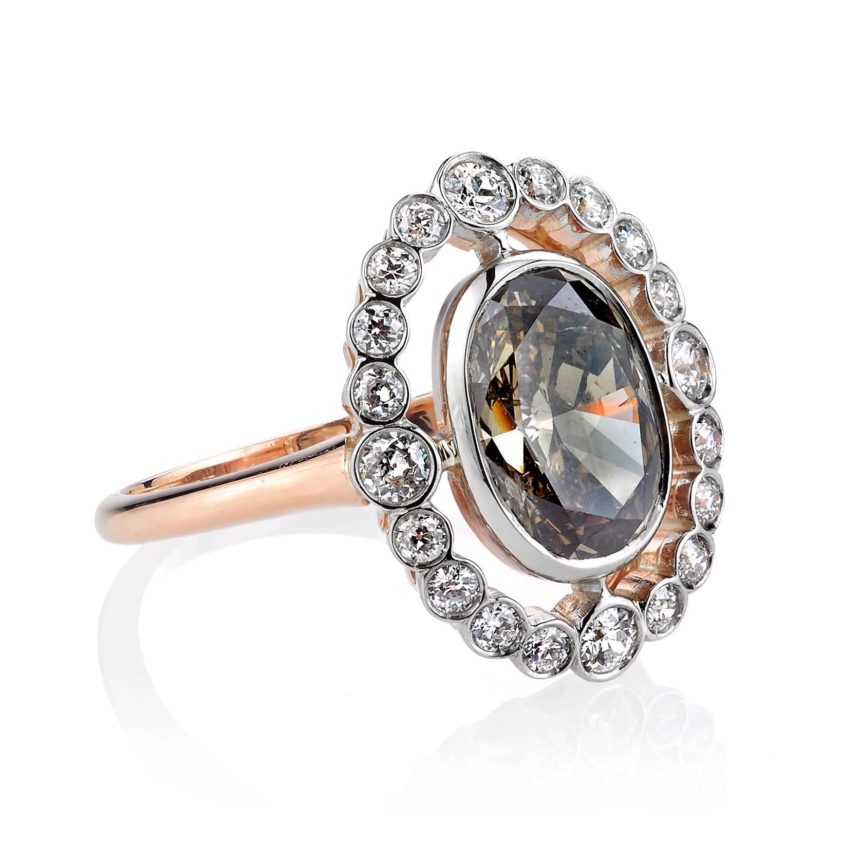 2.41ct Brown/ SI3 Oval cut diamond set in a handcrafted 18k rose gold and platinum mounting.