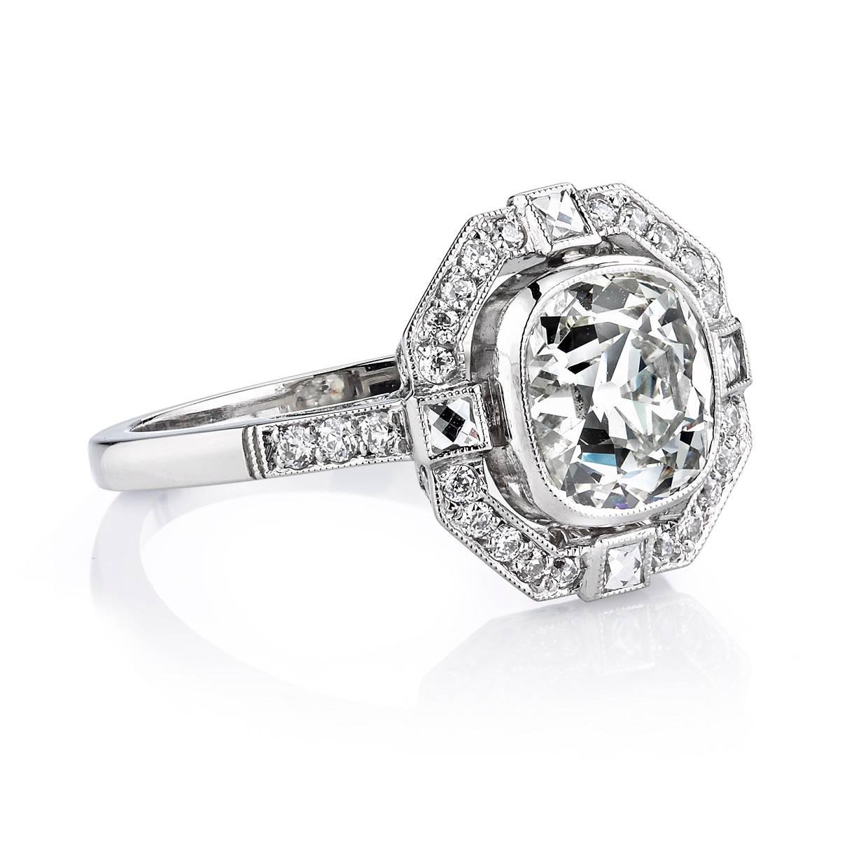 2.38ct K/VS2 EGL certified vintage Cushion cut diamond set in a handcrafted platinum mounting. An Art Deco design featuring a french cut and old European cut diamond halo.