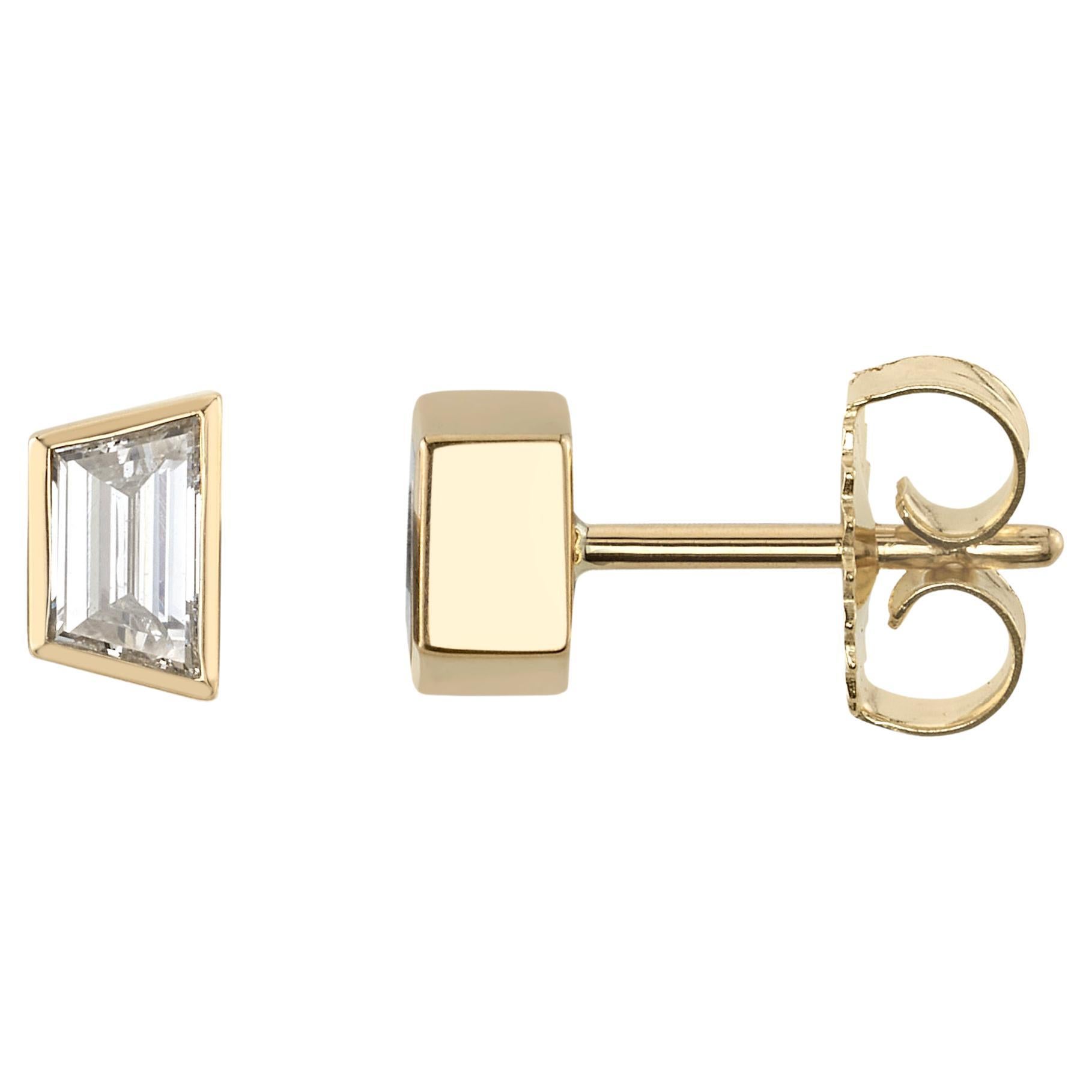 0.98ctw F/VS1 trapezoid cut diamonds bezel set in handcrafted 18K yellow gold stud earrings.

Our jewelry is made locally in Los Angeles and most pieces are made to order. For these made-to-order items, please allow 8-12 weeks for delivery. In-stock