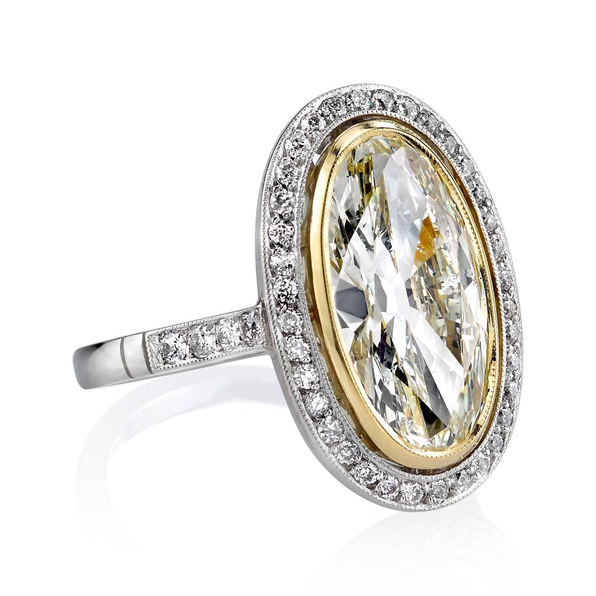 3.49ct OP/VS2 Moval cut diamond set in a handcrafted platinum and 18K yellow gold mounting. 