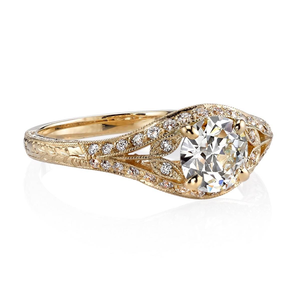 0.80ct L/VS1 old European cut diamond GIA certified and set in a handcrafted 18k yellow gold mounting.  A classic Edwardian design that features filigree, floral motifs, and hand engraving.