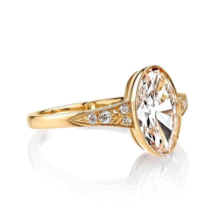 1.52ct G/VS1 Oval cut diamond GIA certified and set in a handcrafted 18k yellow gold mounting.  Elegant detailing meets a clean profile in this one-of-a-kind piece.
