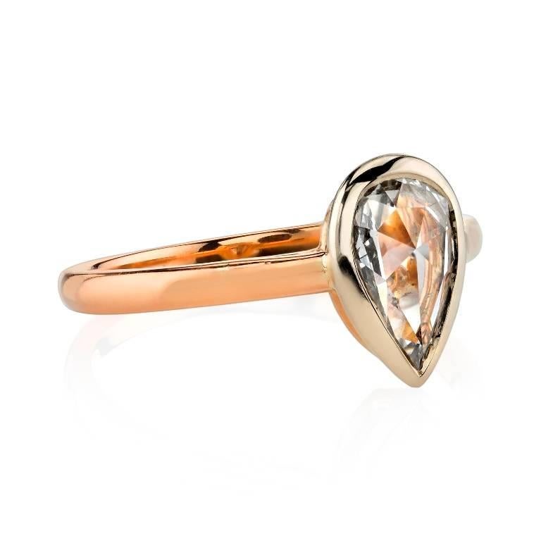 0.60ct IJ/SI Pear Rose cut diamond set in a handcrafted 18k white and rose gold mounting. This pretty Rose cut diamond in an unusual shape gives this ring a sweet and delicate look.