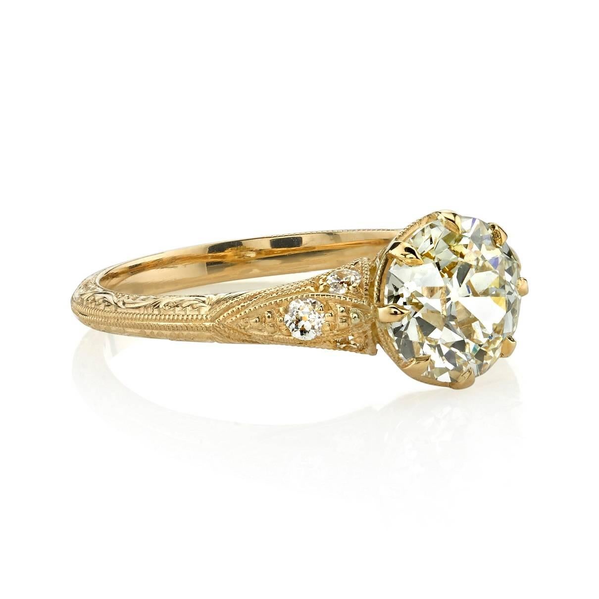 1.53ct J/VS1 old European cut diamond EGL certified and set in a handcrafted 18k yellow gold mounting.  A classic Edwardian inspired design that features tapered engraved band and an intricate gallery.