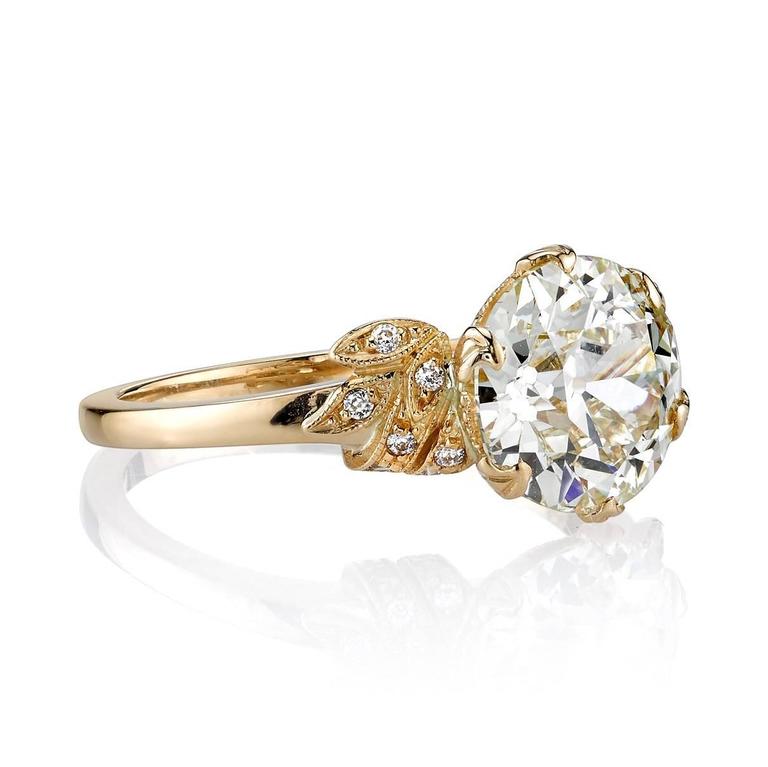 2.58ct L/SI1 EGL certified old European cut diamond set in a handcrafted 18k yellow gold mounting. A classic Victorian inspired design featuring floral motifs.