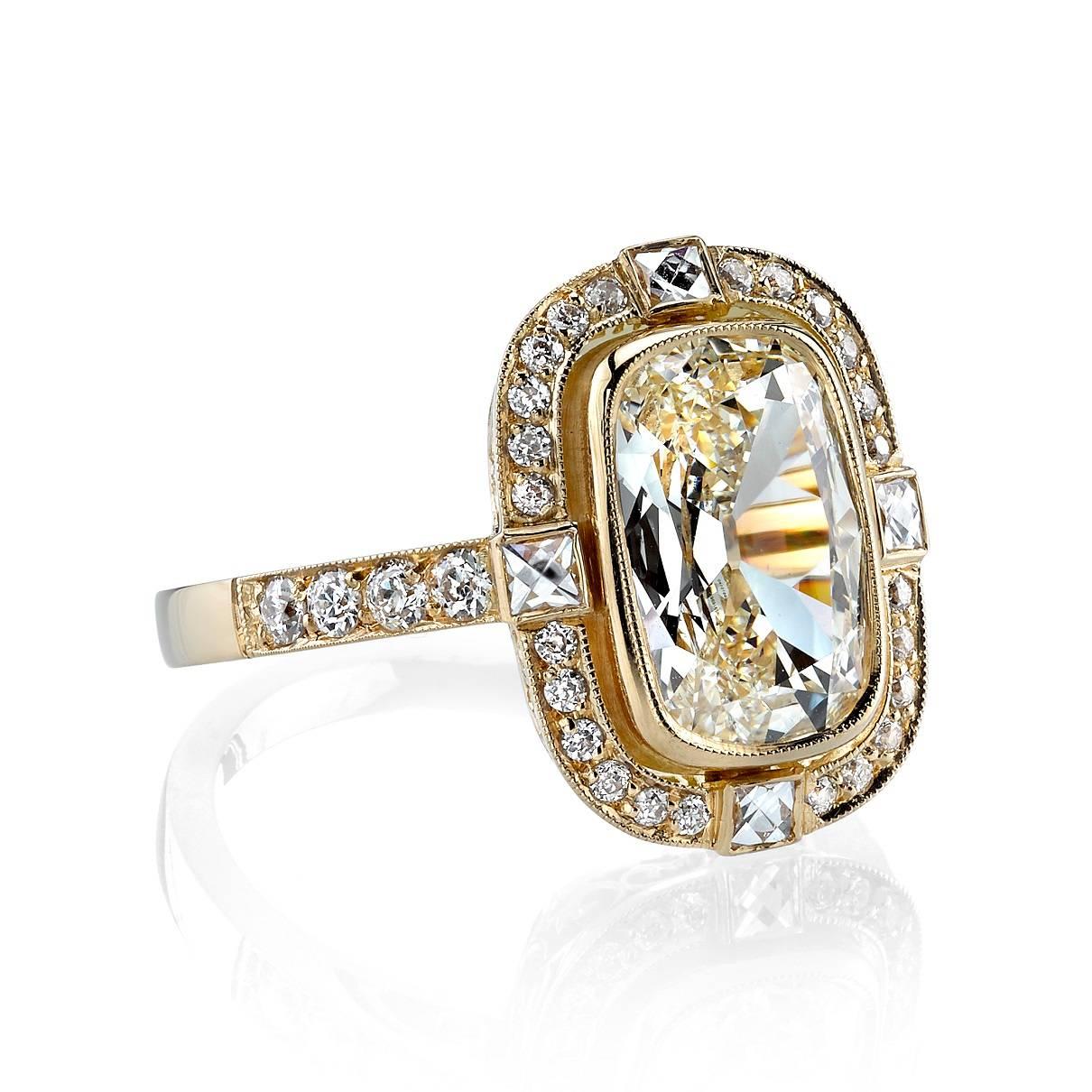 2.52ct J/VS1 Cushion cut diamond EGL certified and set in a handcrafted 18k yellow gold mounting. An Art Deco design featuring a French cut and old European cut diamond halo.