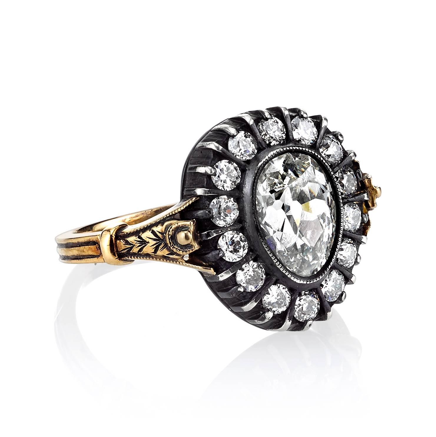 1.27ct G/SI1 EGL certified vintage Pear shape diamond set in a handcrafted 18K oxidized yellow gold and silver mounting. A classic Victorian design featuring a bezel set diamond, two toned metal, and nature inspired motifs on the shank.