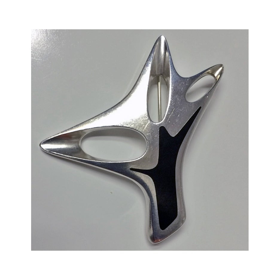 Georg Jensen Henning Koppel abstract enamel and sterling Brooch, Denmark, circa 1969. The Brooch of sculptural abstract form, black enamel. Full marks to reverse and HK for Henning Koppel and numbered 323. See pp 290, 291 and 327 Georg Jensen