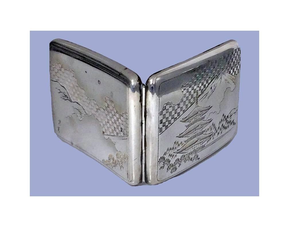 Fine Japanese 950 Silver Case, C.1920. Slightly concave, engraved with scenes of Mount Fuji and Pagoda Building with foliage and pine trees, Signed with Character Marks on underside. Measures 4.25 x 3.00 inches. Weight: 116.04 grams. Minor ding.