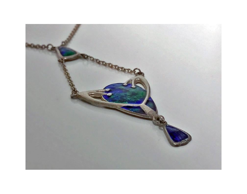 Charles Horner Enamel Pendant Necklace, Chester 1910. The art nouveau arts and crafts design pendant, enamelled with rich green, blue and mauve enamel variations, suspending a stylised foliate enamel section with drop. Hallmarked for Chester 1910 by
