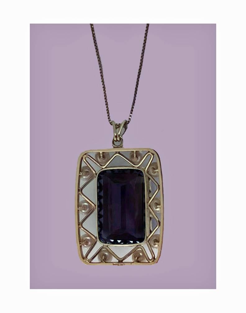 Mid-century 14K quartz and cultured pearl Pendant Necklace, C.1960. The large rectangular pendant claw set with a medium dark brown quartz with slightly pleochroic viloet hues, gauging approximately 28 x 18 x 12 mm and weighing approximately 40.00