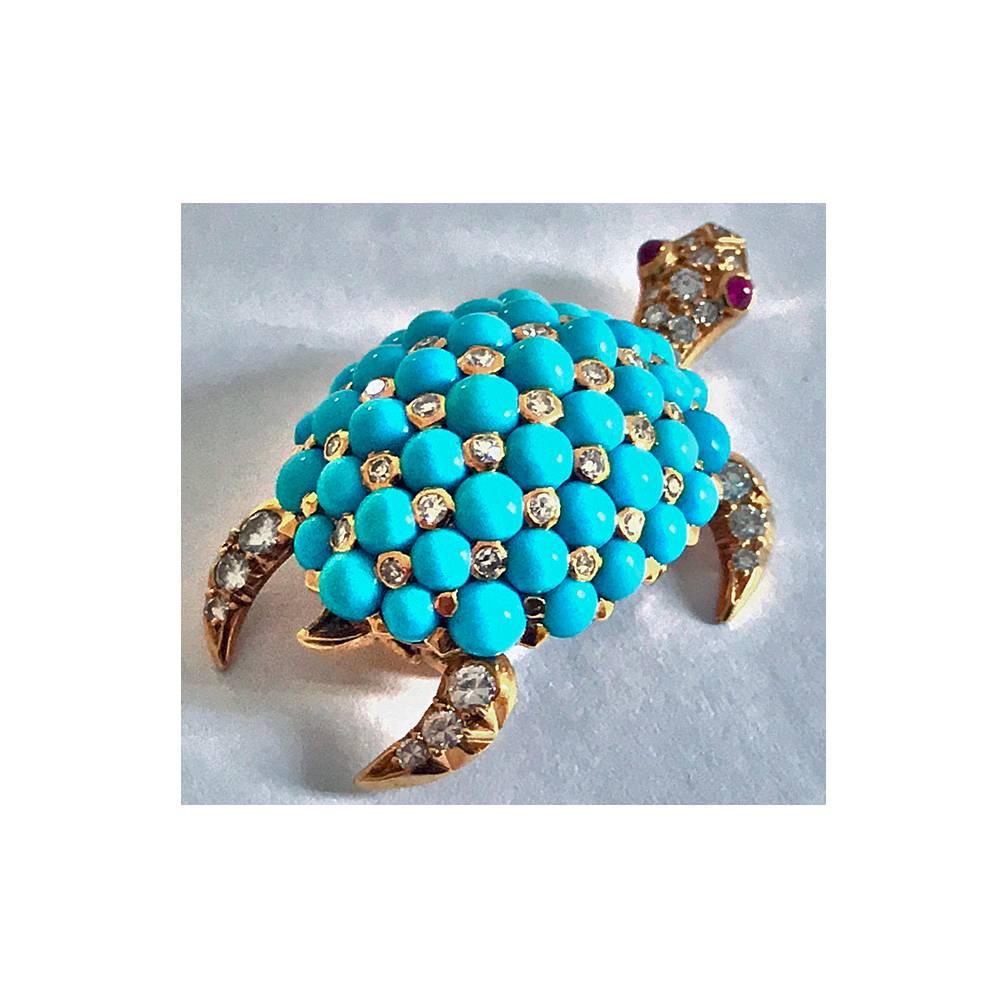 French 18K Turquoise, Diamond and Ruby set Turtle clip Brooch, C.1970, maker’s mark JW. The turtle with movable diamond set head and neck with cabochon ruby eyes. The vertebral shell set with fine turquoise interspaced with diamonds, the front and