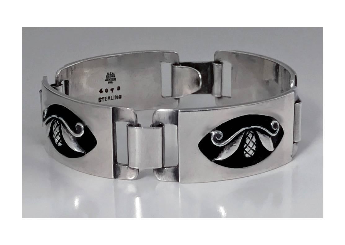 Rare Georg Jensen Sterling Bracelet designed by Laurence Foss, C.1940. The Bracelet with hinged rectangular convex links, decorated with applied pine cone leaf design. Full Georg Jensen Inc. marks to reverse and design number 407B. Length: 6 5/8