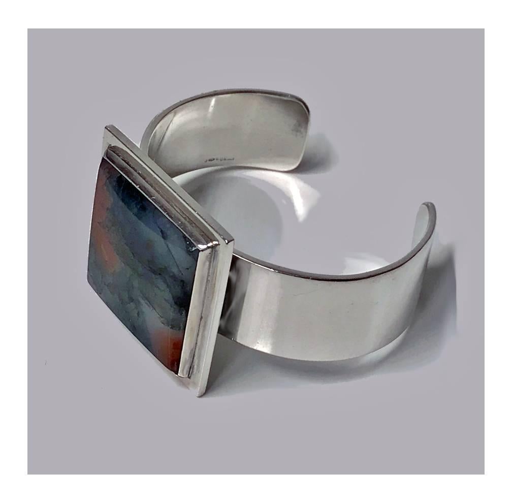 Rare Sterling Silver Moss Agate Bangle, Bent Knudsen Denmark C.1960. Signed Bent K Sterling Denmark. Design number 173. Item Weight 60.48 grams. Will fit up to 6.5 inch wrist. There is a little flexibility to increase size because of the opening.