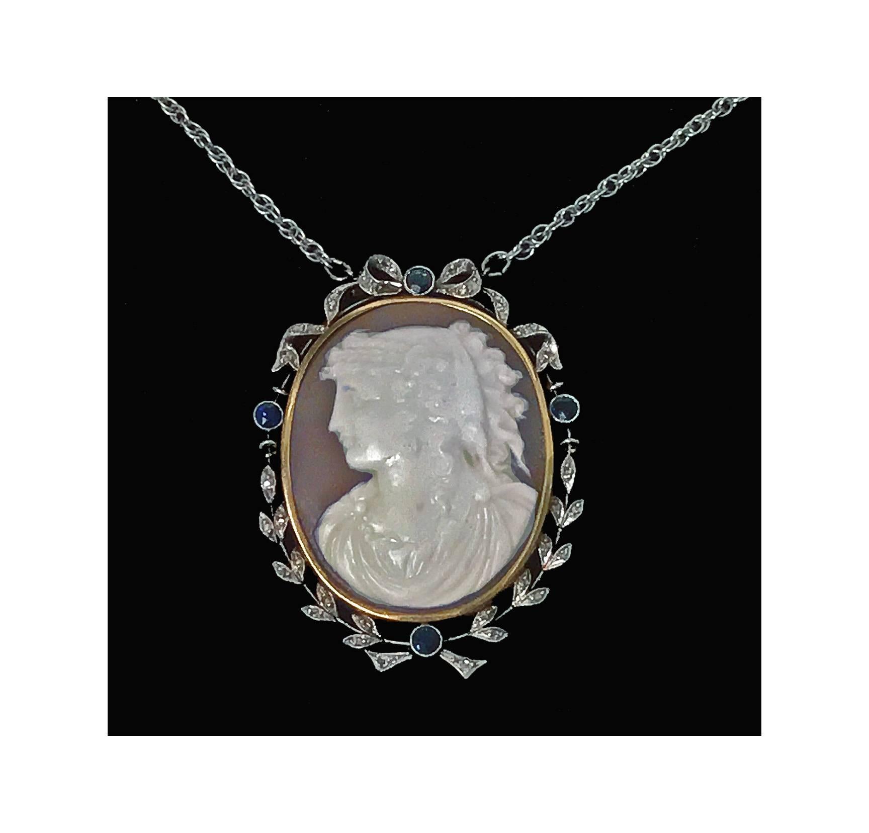 Antique Platinum and 15K Cameo Pendant with Diamond and Sapphire mount, English, C.1920. The oval cameo depicting a lady with headdress facing sinister; platinum and gold (both tested) Diamond and Sapphire festoon surround mount, set with