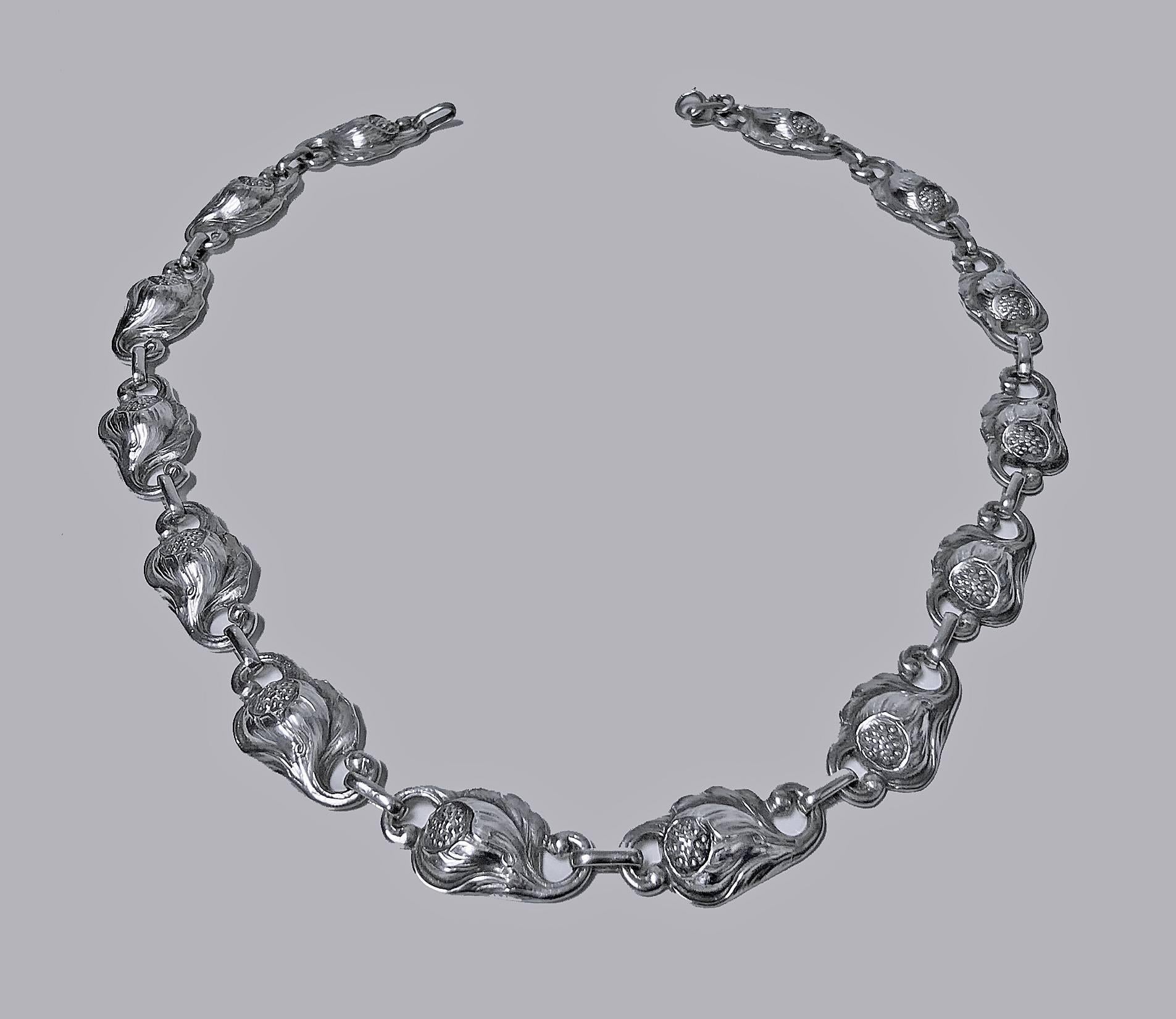 Carl Poul Petersen hand made Sterling Silver Necklace, Montreal C.1940. The Necklace with fourteen organic foliate open bud motif links, later spring ring fastener. Reverse with marks hand made Sterling PP for Petersen and Canadian silver mark.