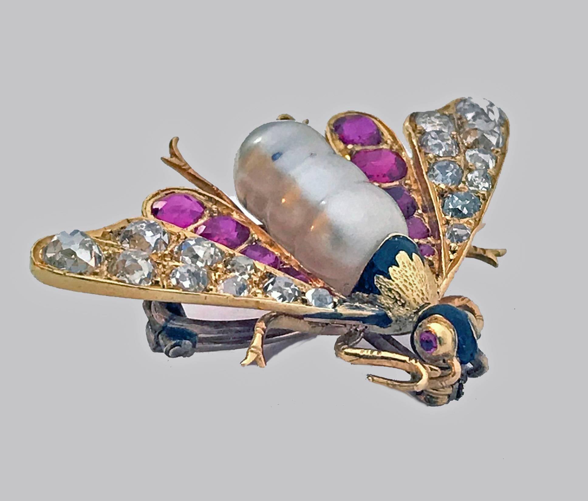 Antique 18K Ruby Diamond and Pearl Bee Brooch Pin, C.1880. The brooch with a baroque pearl body, wings set with 10 cushion purple red rubies and eighteen old mine cut diamonds respectively, the eyes inset with small cabochon rubies, the head with