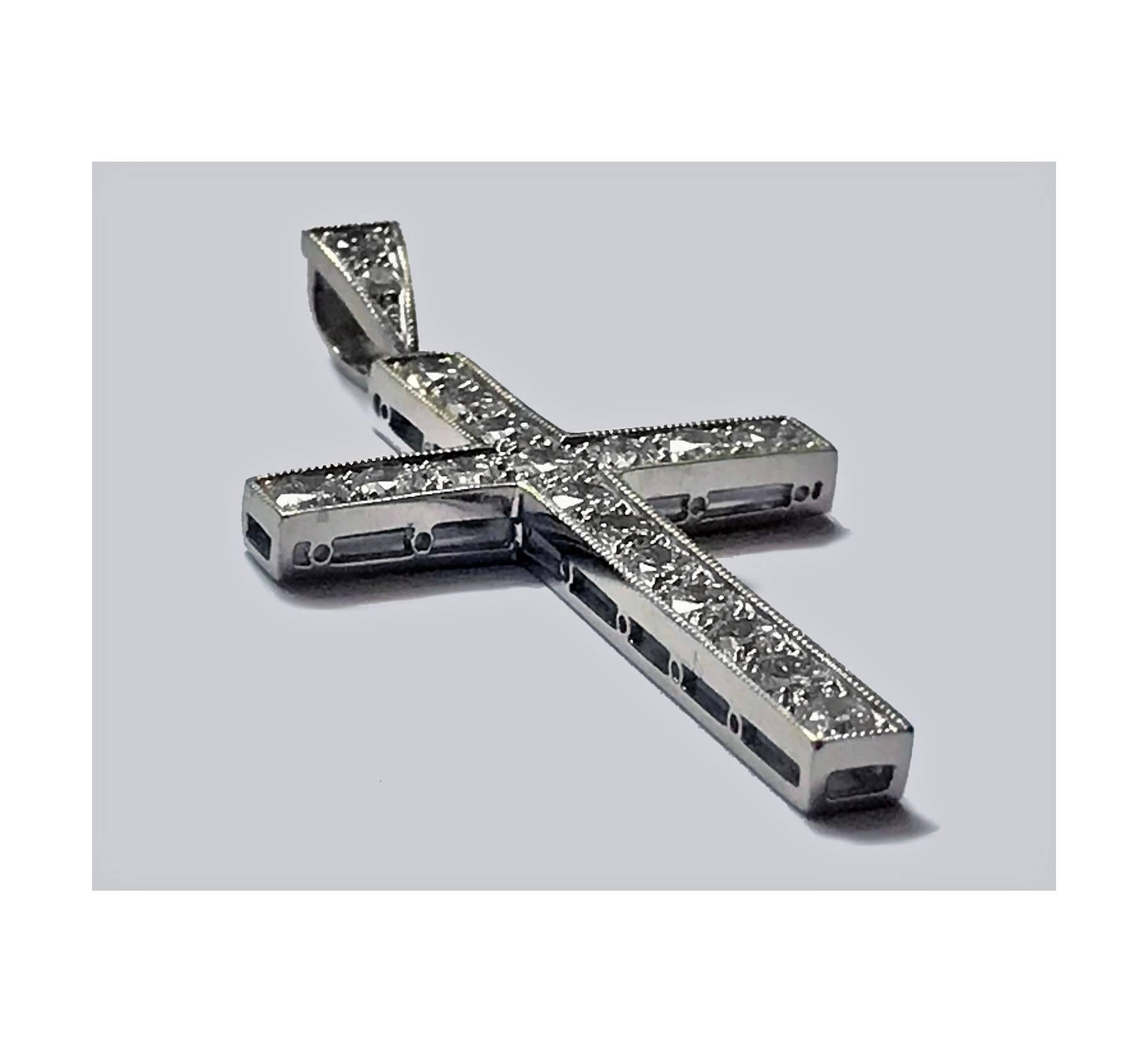 Diamond Cross mounted in Platinum (tested), C.1930. The Cross milligrain set with nineteen round brilliant cut diamonds, approximately 1.00 ct, average VS-SI clarity, average I colour, split gallery. Measures: 1.75 x 0.875 inches. Item Weight: 4.94