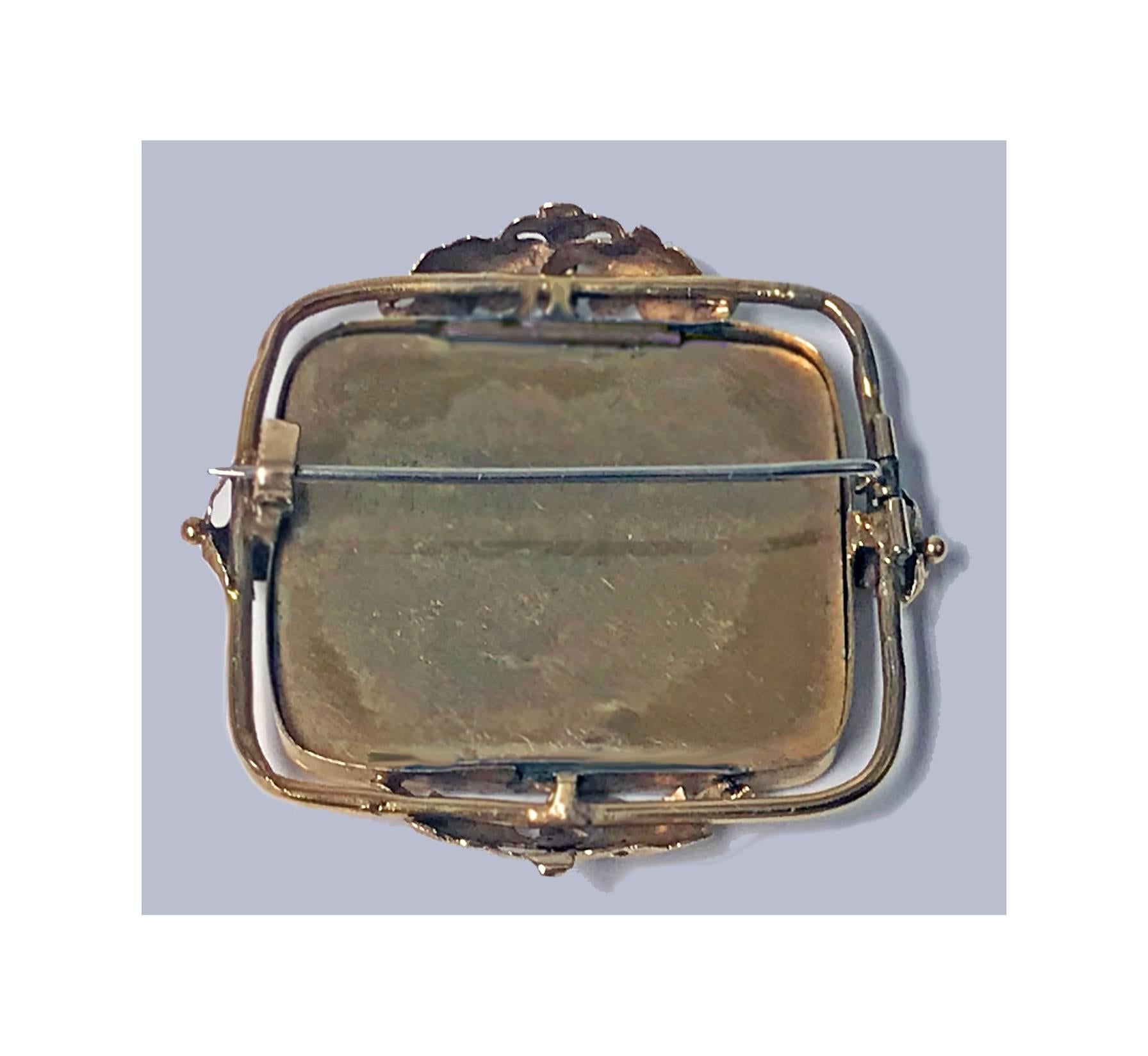 the brooch contains a miniature picture