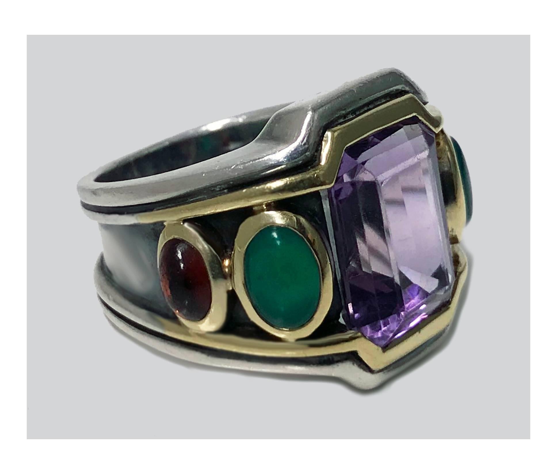 Bold Seiden Gang 18K Sterling Gem set Ring, 20th century. The Ring of classic architectural design set with a step cut amethyst, gauging approximately 13 x 11 x 7 mm, flanked on either side with gold bezel set cabochon Chrysoprase and garnet