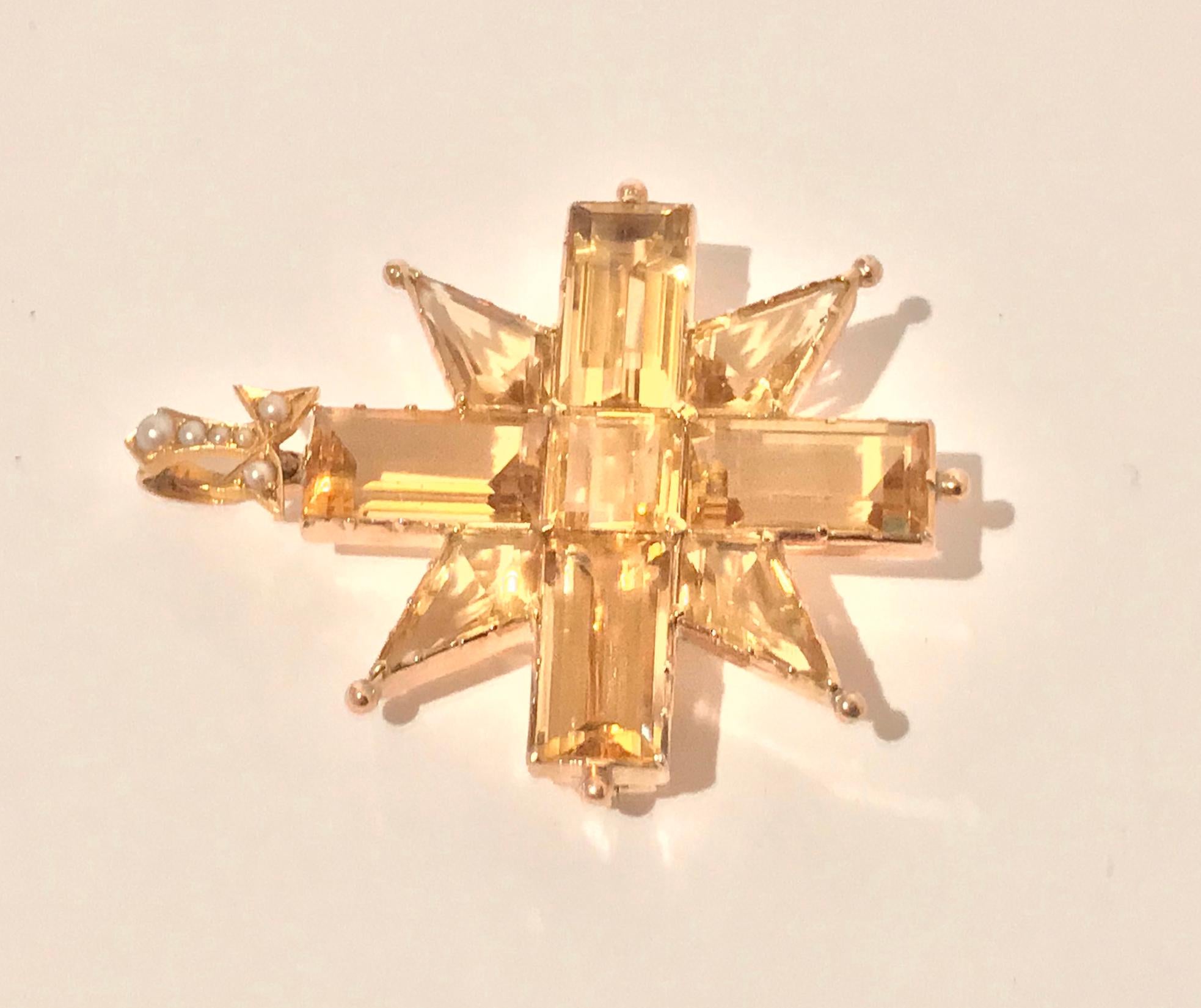 Antique 14K Gold Citrine Maltese Cross Pendant Brooch, C. 1900. The Cross claw and bead set with custom cut citrine surmounted with detachable fleur de lays seed pearl set bale for pendant. Pin to reverse. Gold acid tested 14K. Measures: