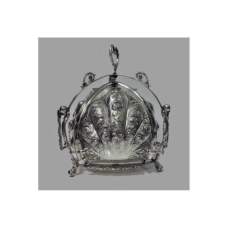 Rare 19th century Continental Silver biscuit box of rare folding form, C.1890. The box opening to reveal triple lobe sectional `blossom' compartment, rococo inspired repoussé motif  of roses and scrolls. Marked with crescent, moon,800 (silver) for