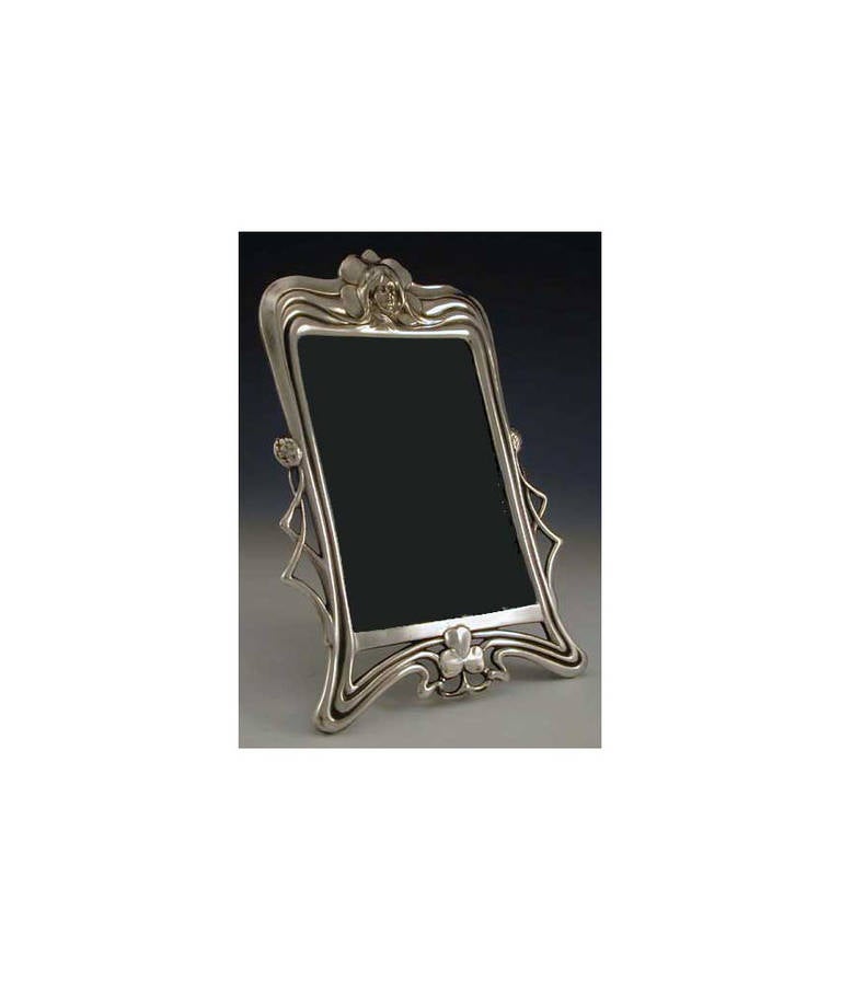 WMF Art Nouveau Jugendstil silver plate photograph frame, Germany, circa 1900, WMF. Ref no 90 page 304 WMF 1906 catalogue. WMF marks. Overall measurements: 8 3/4 x 5 3/4 inches. Photograph measurements: approximately 5 1/4 x 3 3/4 inches.