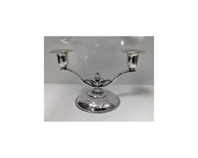 Cellini hand wrought Sterling silver Candlesticks candelabra, C.1940. Each of hammered design on dome bases with scalloped edging, the centres with open foliate section, supporting two light branches, plain hammered design. Stamped for Cellini Craft