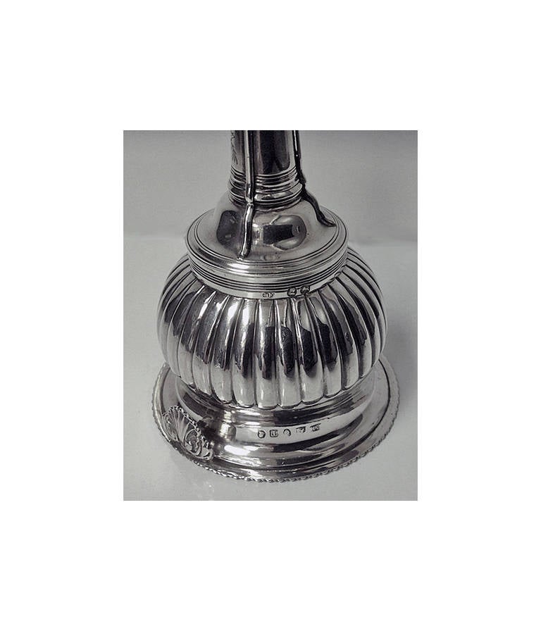Antique Georgian Silver Wine Funnel, London 1814, Charles Fox 1. The Funnel of typical form, the base with gadroon surround, fluted body, strap work funnel, shell thumbpiece. Marked on body and strainer. Height: 5 ¾ inches. Weight: 103.62 grams.