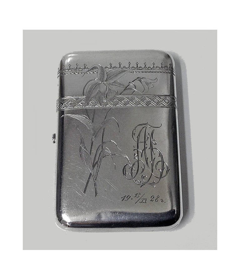 Russian Silver cigarette case, 1896-1908, D.P. Nikitin. The box with engraved foliate decoration, maker's mark DN (Cyrillic) for D.P. Nikitin , Kokoshnik mark for assayer Ivan Sergeyevich Lebedkin, Moscow, 84 zolotnik, 4.125 x 2.75 