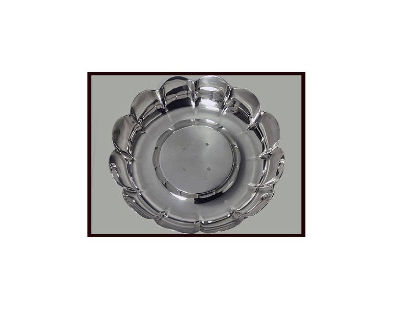 Irish Silver Strawberry Dish, Royal Irish Silver Co, Dublin 1973, plain paneled scalloped form. stamped with Glenisheen collar mark, EEC commemorative mark. Diameter: 10 inches. Height: 2 ½ inches. Weight: 24 ½ oz.