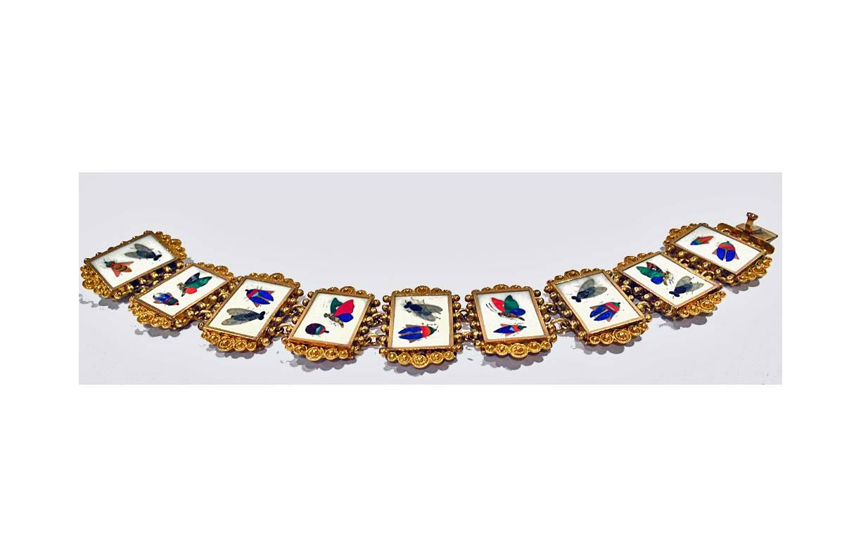 Very Fine 19th century Gold Pietra Dura Bracelet, Italy C.1875. The bracelet with nine pietra dura links depicting various butterflies and insects, within etruscan cannetille gold mounts, links between. Length: 7 inches.  