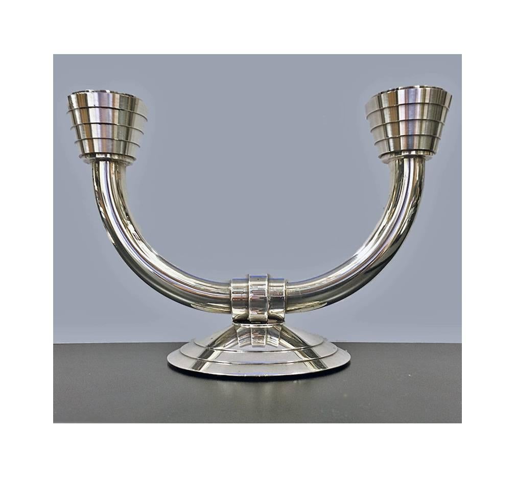 Pair of Christofle art deco design silver plate candelabra candlesticks, France C.1980. The two light candelabra, a `Folio’ streamlined ribbed design. Full Christofle marks to base. Measures: 8 x 5 ¼ inches.