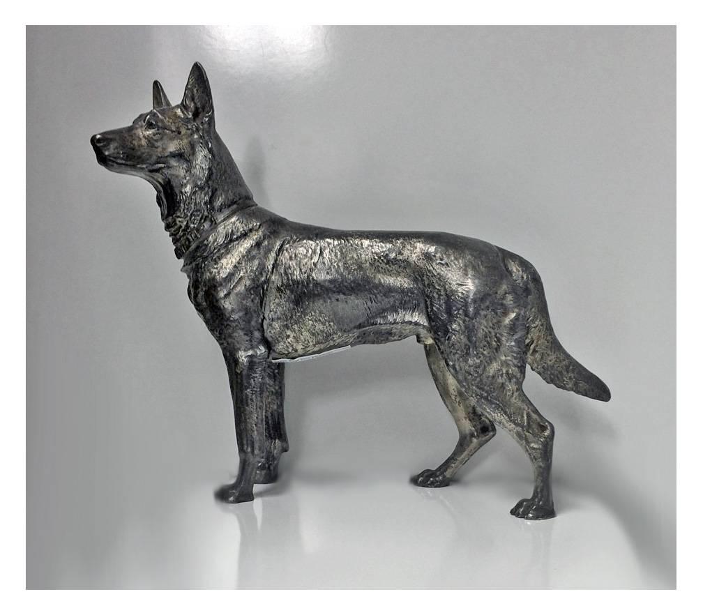 WMF Silver plate Alsatian German shepherd Dog, Germany C.1900. The oxidised finish figurine realistically modelled and textured. Full WMF marks to heel of foot.  Measures: approximately 10 x 8.5 inches.