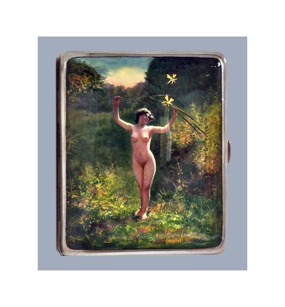 Enamel and Silver erotic Nude Cigarette Box, Continental C.1920. The cover of the box enameled with a nude figure of a standing nude lady in a forest setting with sunset and dragon flies, arms outstretched, holding aloft branches of foliage Stamped