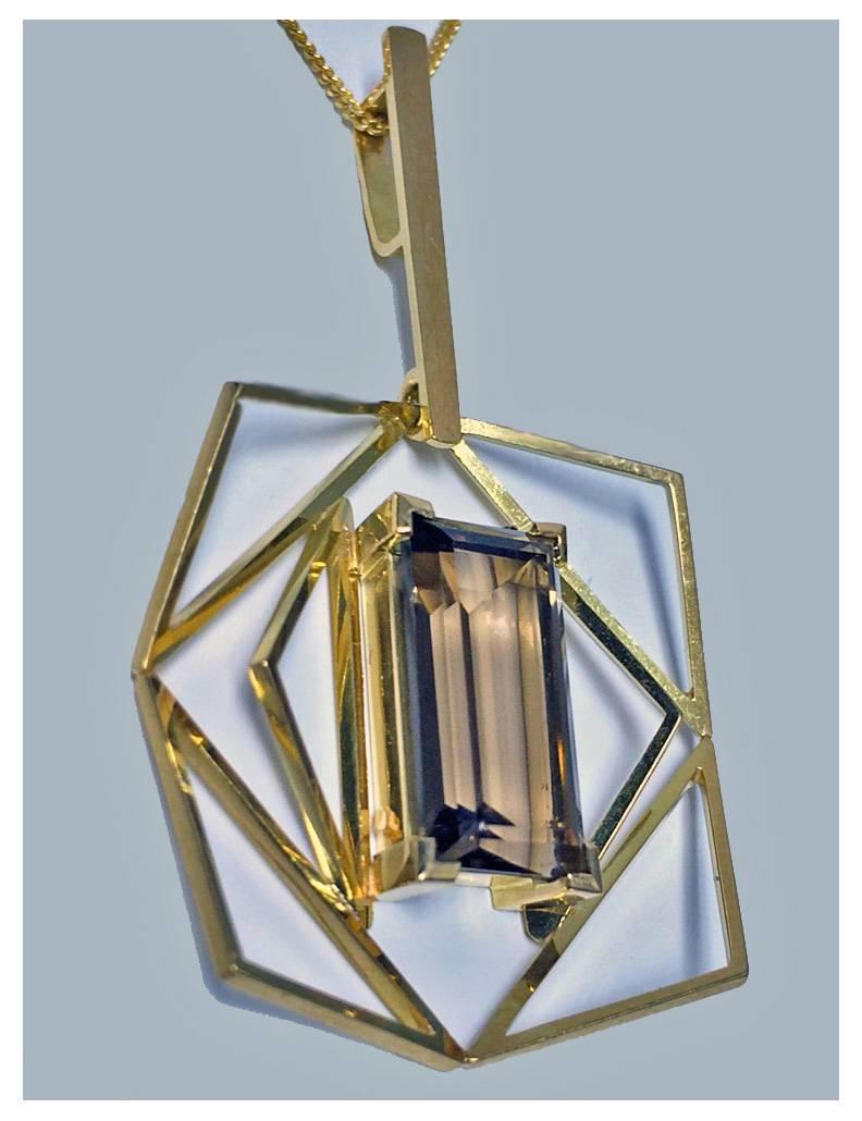 18K and Quartz Abstract Pendant Necklace, C.1960. (later 18K chain attached). The pendant centering a rectangular faceted smoky quartz, approximately 3.00 ct, within an octahedron and lozenge open setting. English 18ct hallmarks. Length: 18 inches.