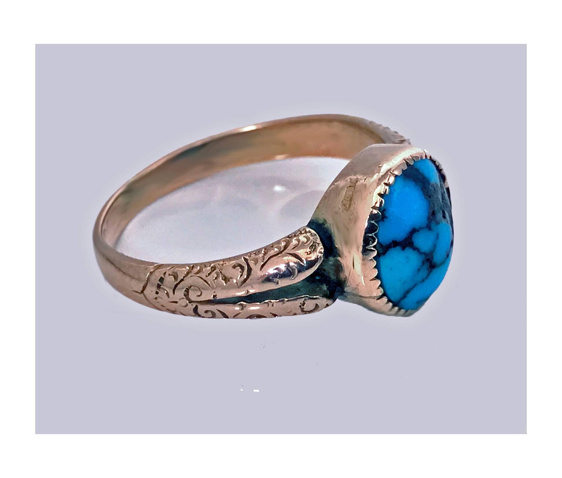 English Arts & Crafts Gold and Turquoise ring, Birmingham 1906. The ring set with a cabochon turquoise, deeply bezel set, split design foliate engraved shoulders, plain shank, hallmarked on interior for 0.375 (9K) and Birmingham 1906. Total item