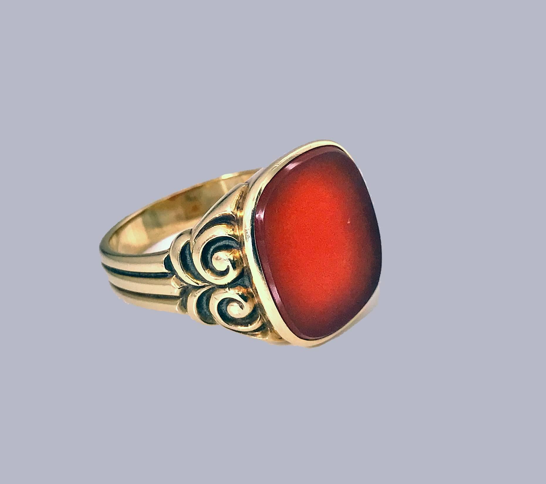 Antique Gold Carnelian Ring, C.1890. Nice large size, unengraved lively orange carnelian, approximately 16 x 14 mm, carved and ribbed shoulders, plain shank. Stamped 585. Ring Size: 10.25. May be sized. Item Weight: 8.10 grams. 