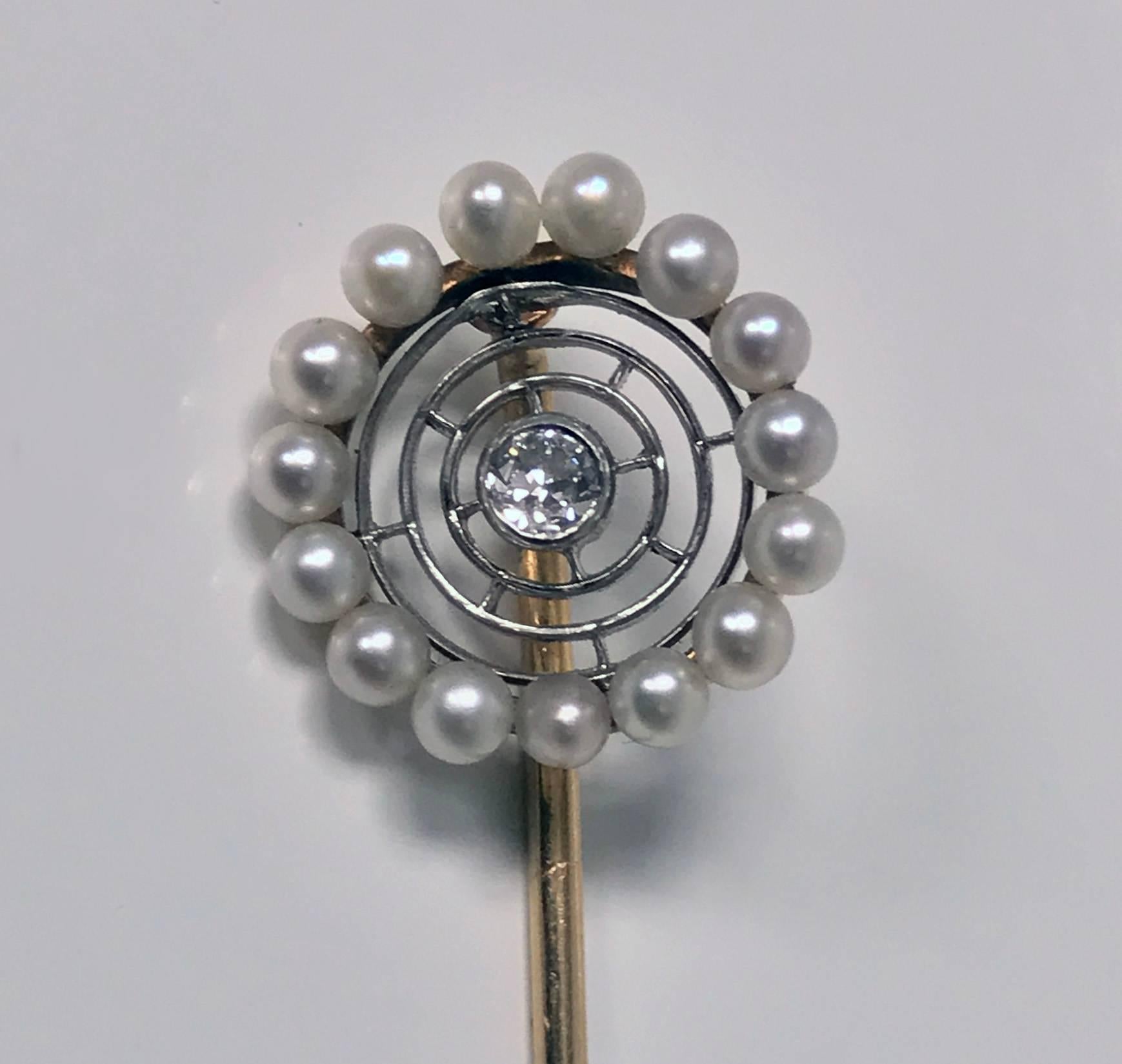 Antique Hans Brassler Diamond, Pearl, Gold and Platinum Stickpin, American, C.1900. The Stickpin of a spider web design, set in the centre with an old cut diamond, approximately 0.07 ct and a surround of 15 round pearls (untested for natural),