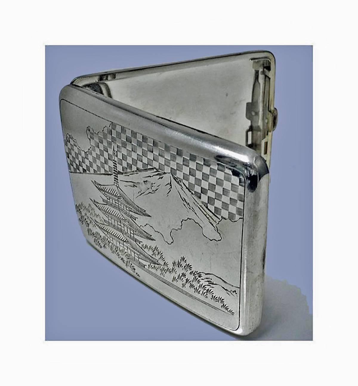 Fine Japanese 950 Silver Box Case, C.1920. Slightly concave, engraved with scenes of Mount Fuji and Pagoda Building with foliage and pine trees, Signed with Character Marks on underside. Measures 4.25 x 3.00 inches. Weight: 116.04 grams.